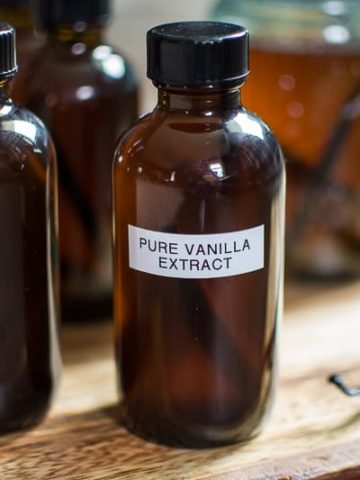 homemade vanilla extract in jars with labels