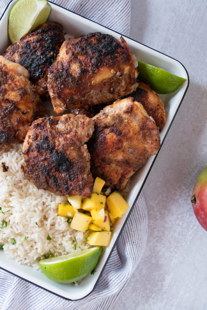 jamaican jerk chicken smoked in the oven served with rice and mango salsa