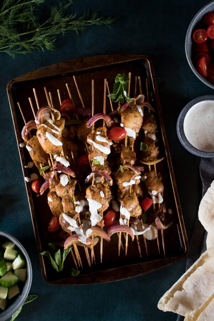 grilled chicken shawarma on wooden skewers