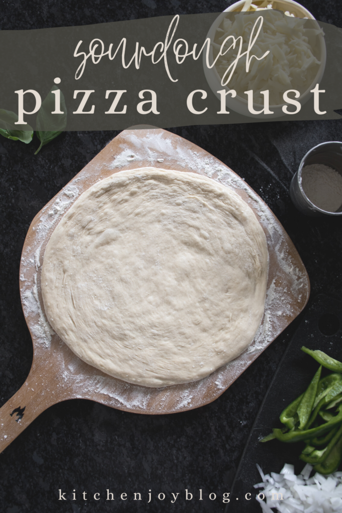 sourdough pizza dough crust recipe, freshly made pizza dough arranged on a pizza peel ready for toppings