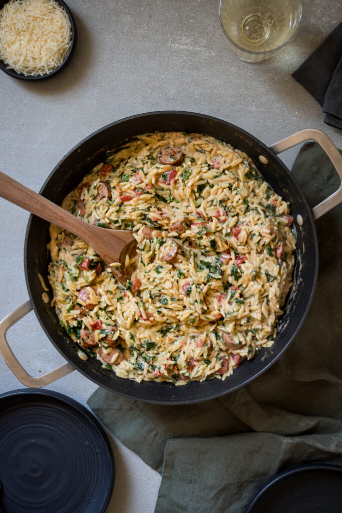 One-pot orzo recipe with Italian sausage, Spinach, and Tomatoes

