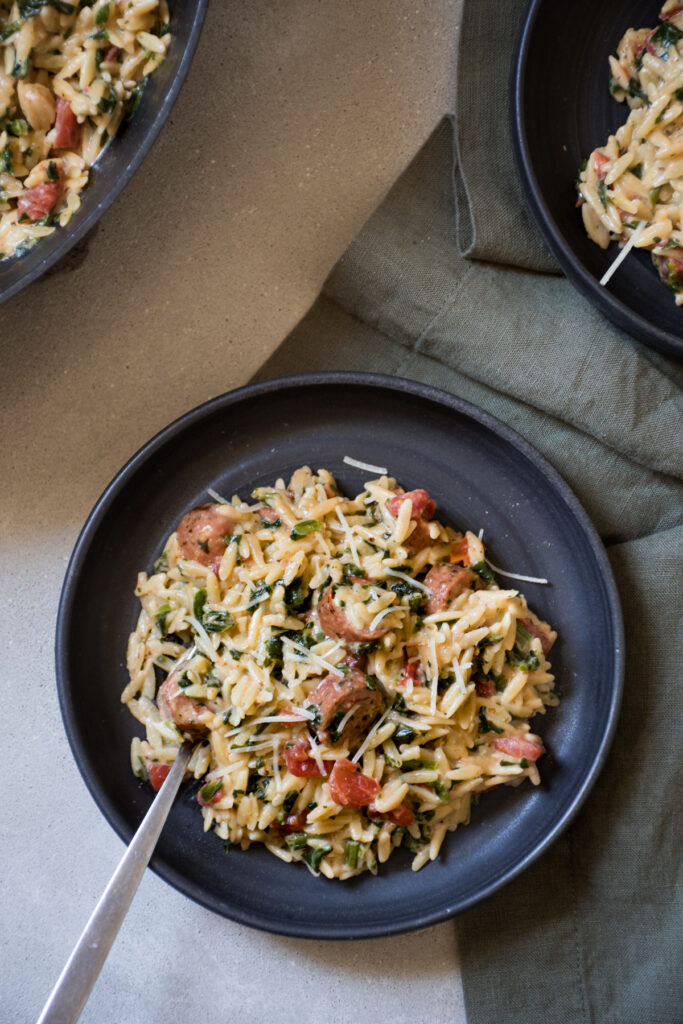 One-pot orzo recipe with Italian sausage, Spinach, and Tomatoes
